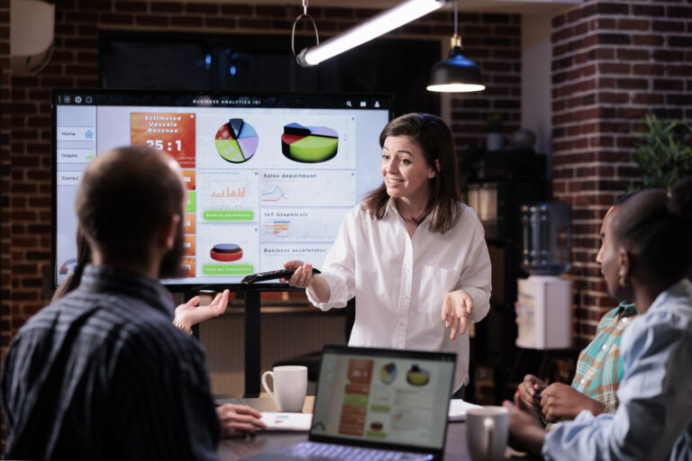 smiling woman startup office doing business presentation